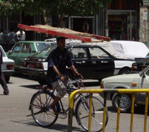 Bicycle rider with bread